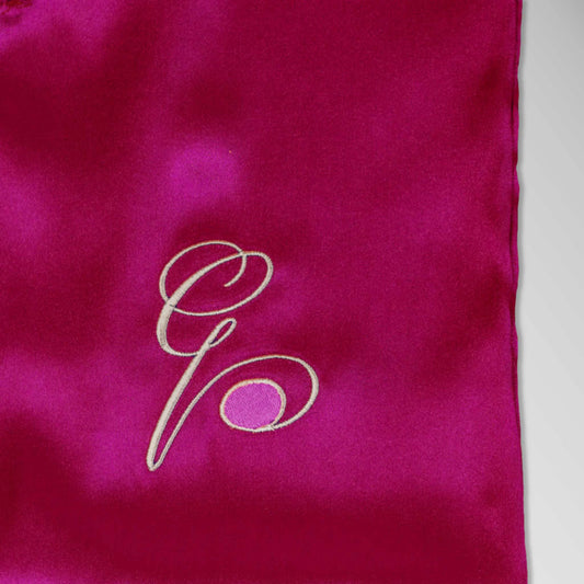 Pillowsforeplay Slip - Close up showing the high quality pink slip with Elegant black cursive "G" with a pink circle #variant:slip-color-pink-satin-slip